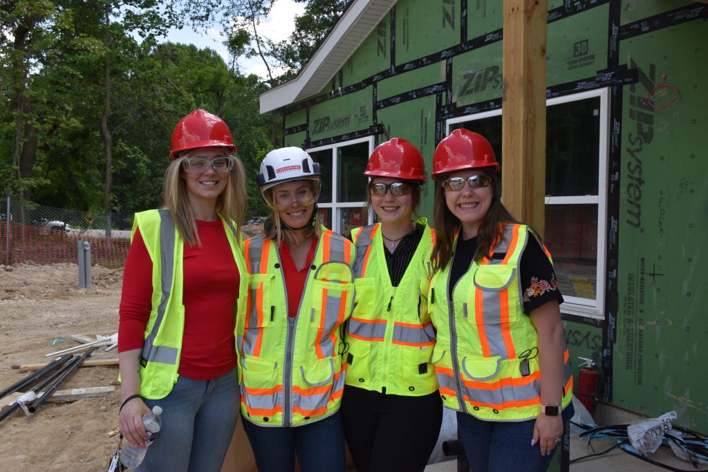 Women of Chesapeake smiling at the camera on Eagle Park jobsite.